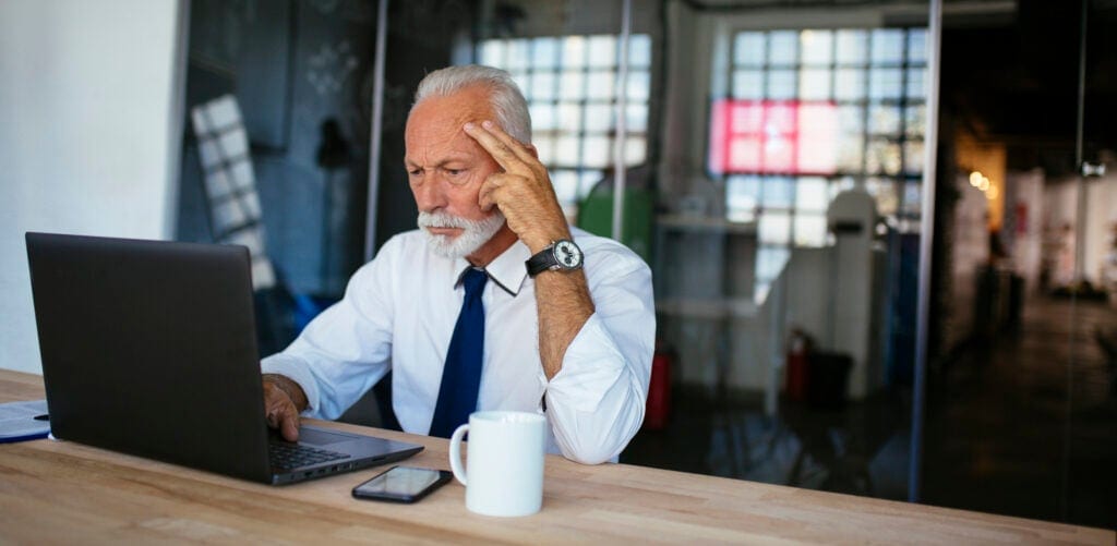 older man laptop serious gettyimages JjIG