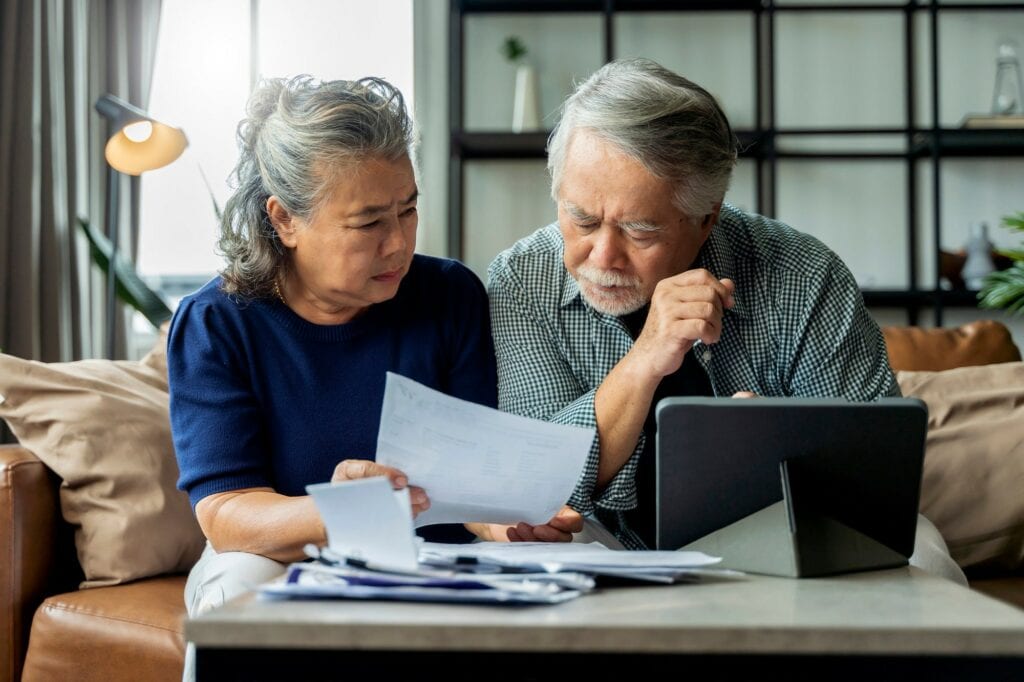 people with concerned expressions looking at document