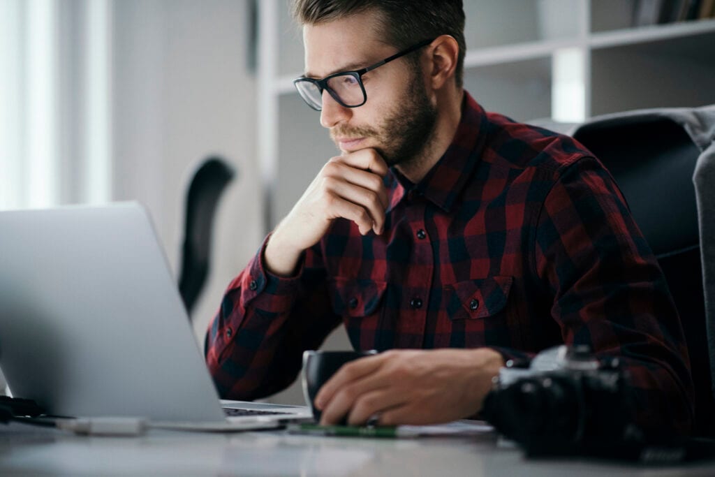 man s at desk serious gettyimages