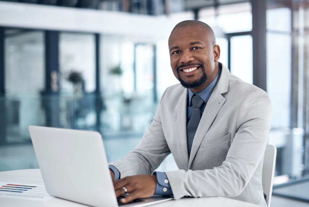 man s business suit laptop gettyimages xRtoVl
