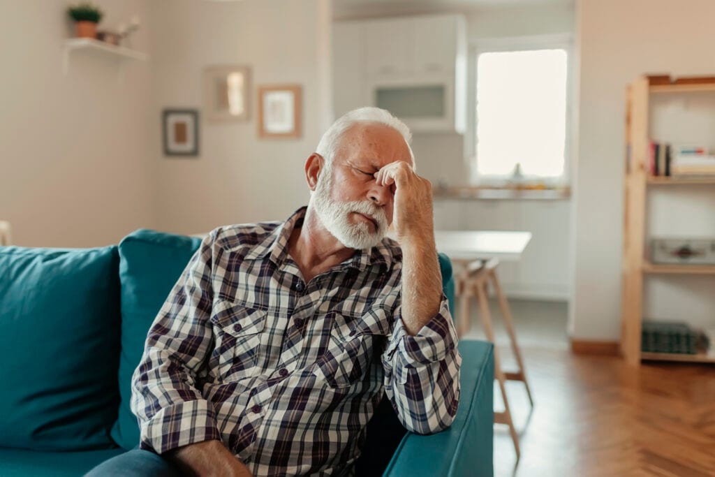 older man couch headache gettyimages