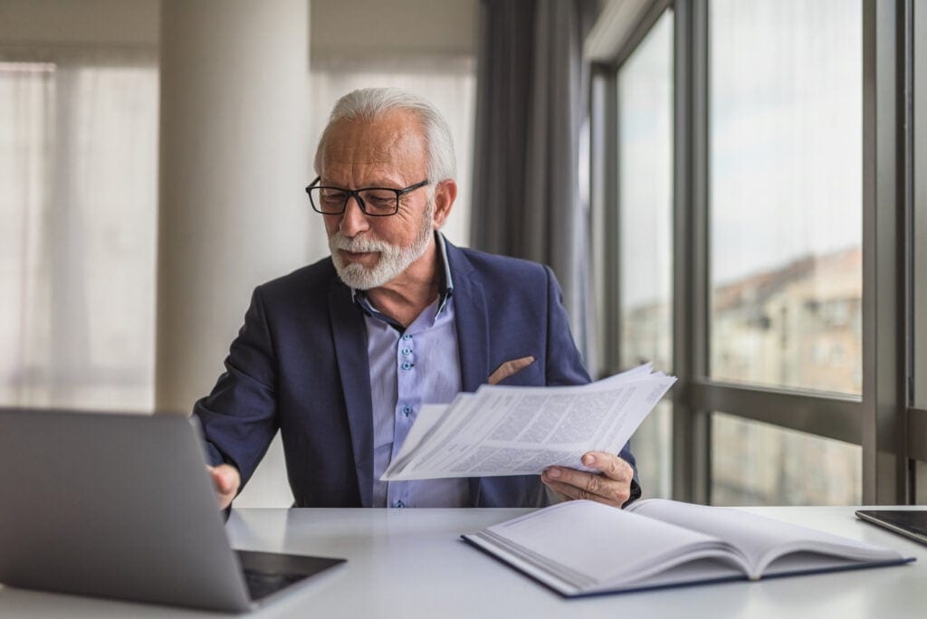 older man professional laptop gettyimages wnN