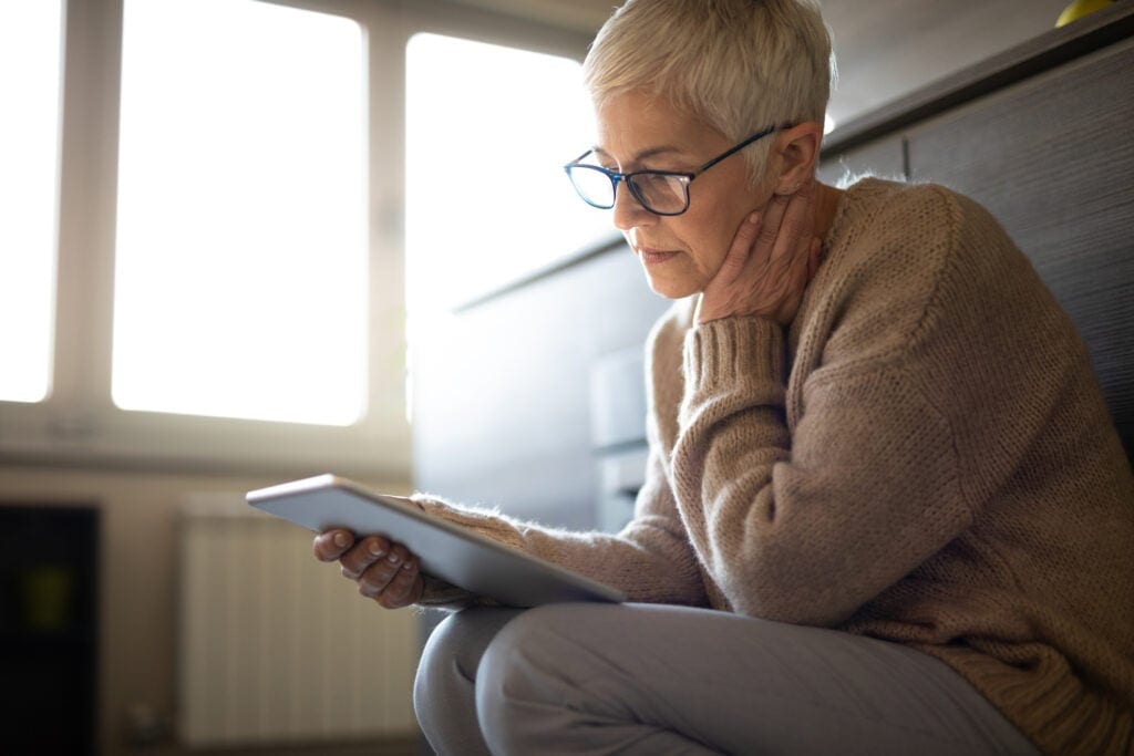 senior woman holding tablet gettyimages