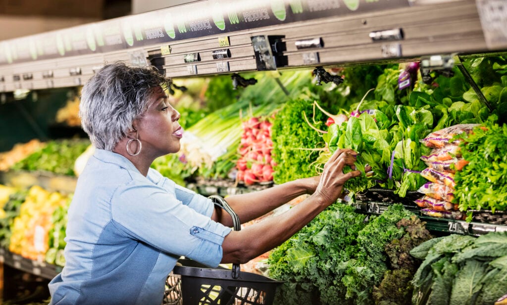 senior woman produce aisle gettyimages