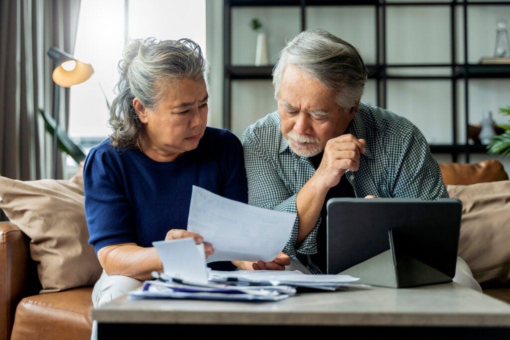 serious couple looking at documents together