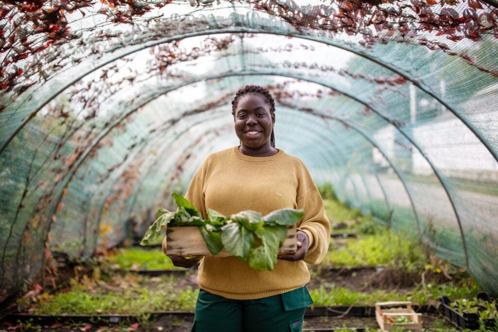 happy person in greenhouse