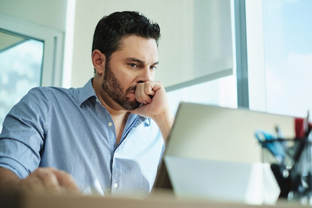 man in s desk serious nervous gettyimages