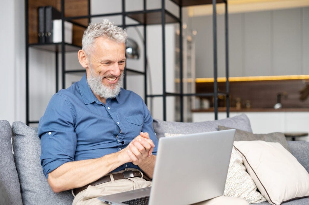 a person looking at a laptop