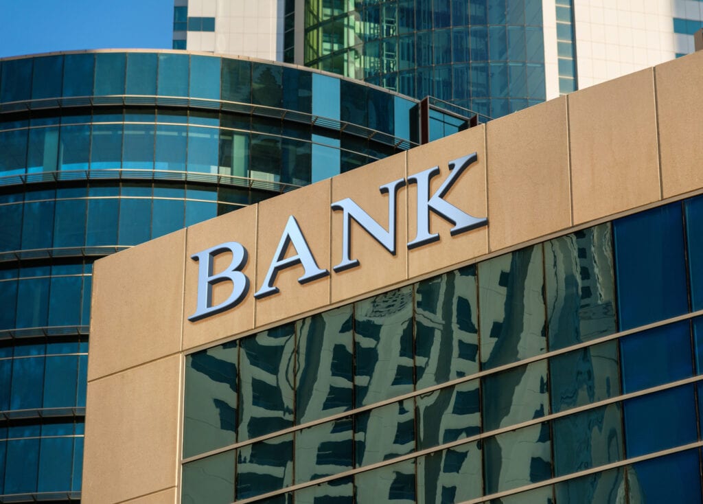 bank sign on glass wall of business center