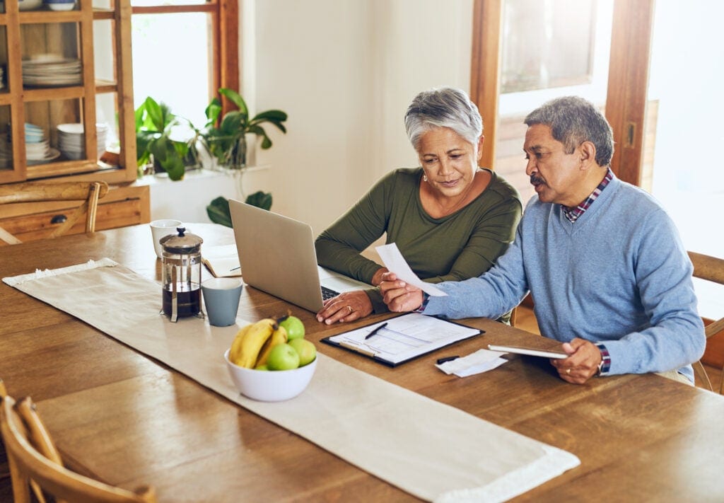 mature couple managing their paperwork in retirement