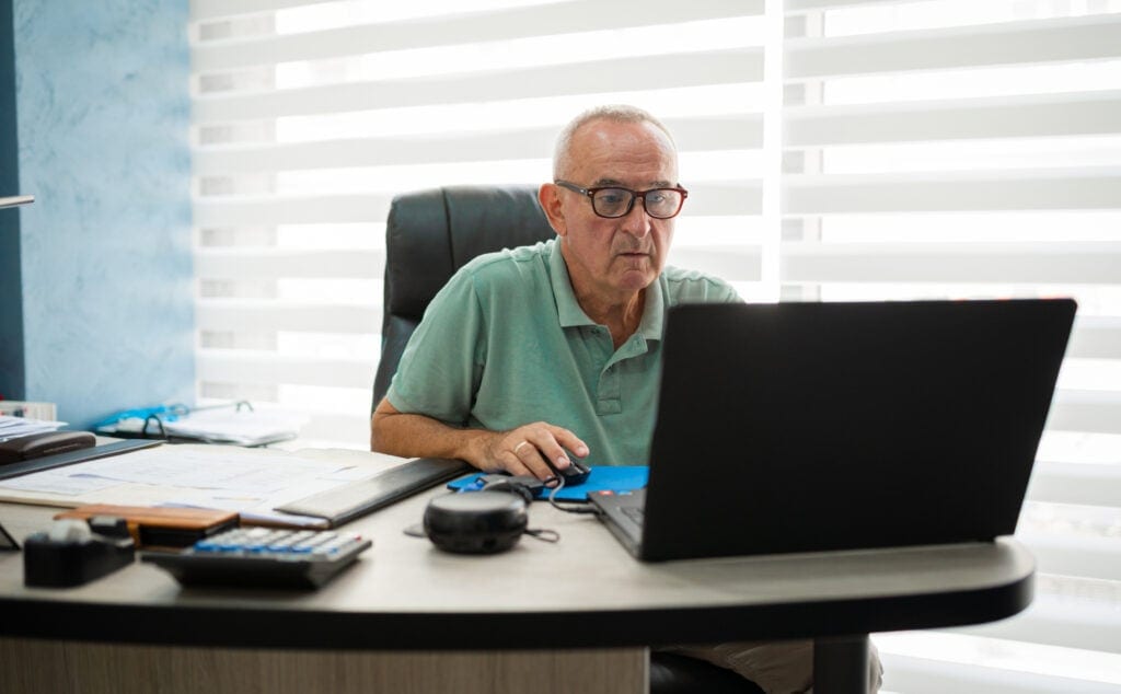older man desk serious gettyimages