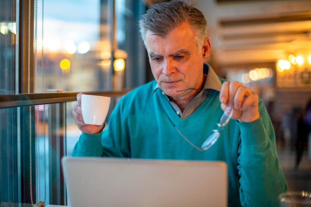 older man serious laptop gettyimages