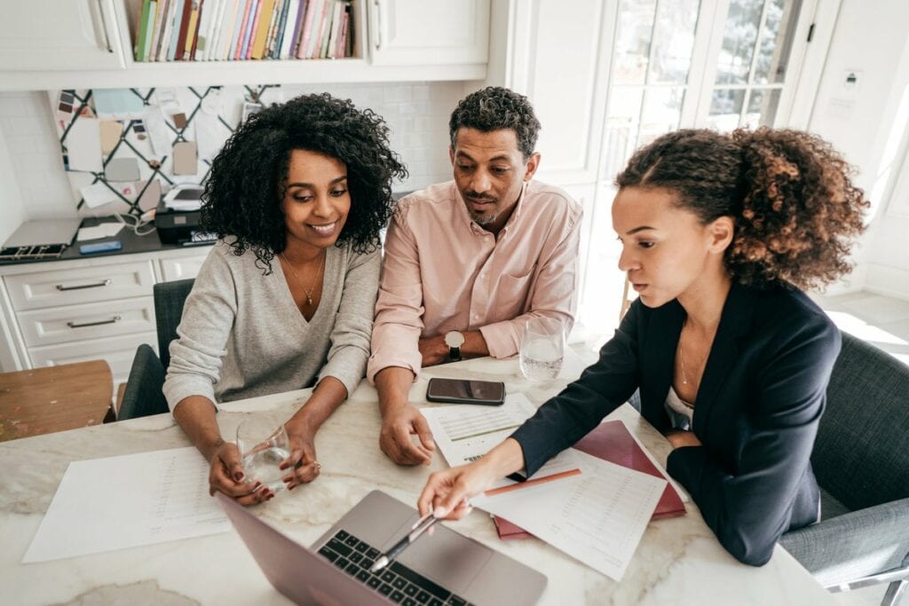 Couple discuss finances with lender PIDvJe.width
