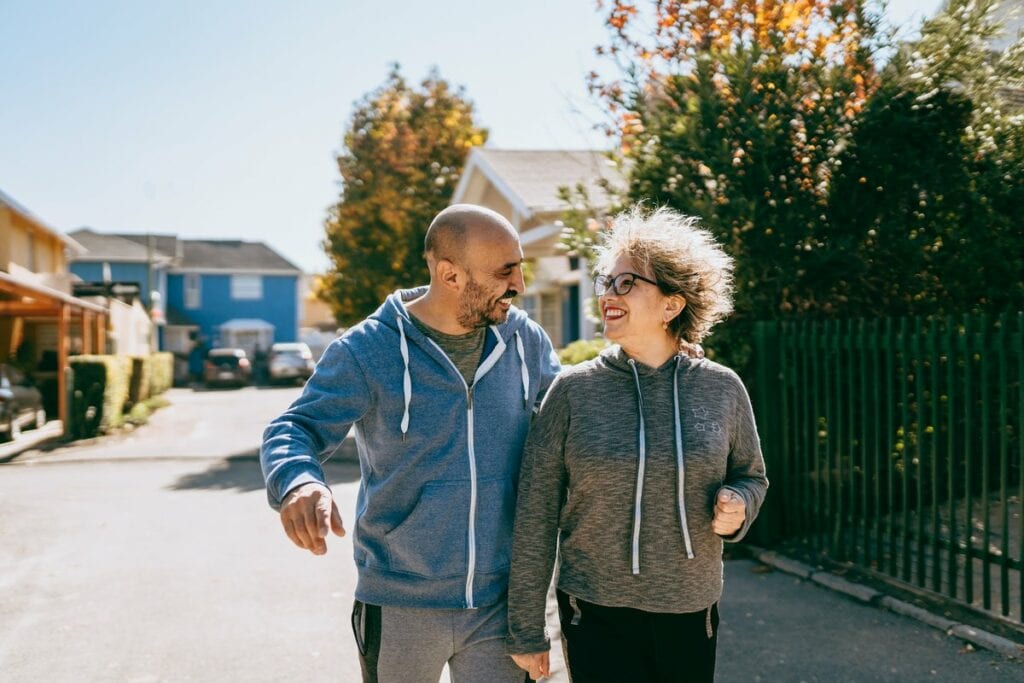 Couple walking in neighborhood of gated commu.width SuvQq.jpg