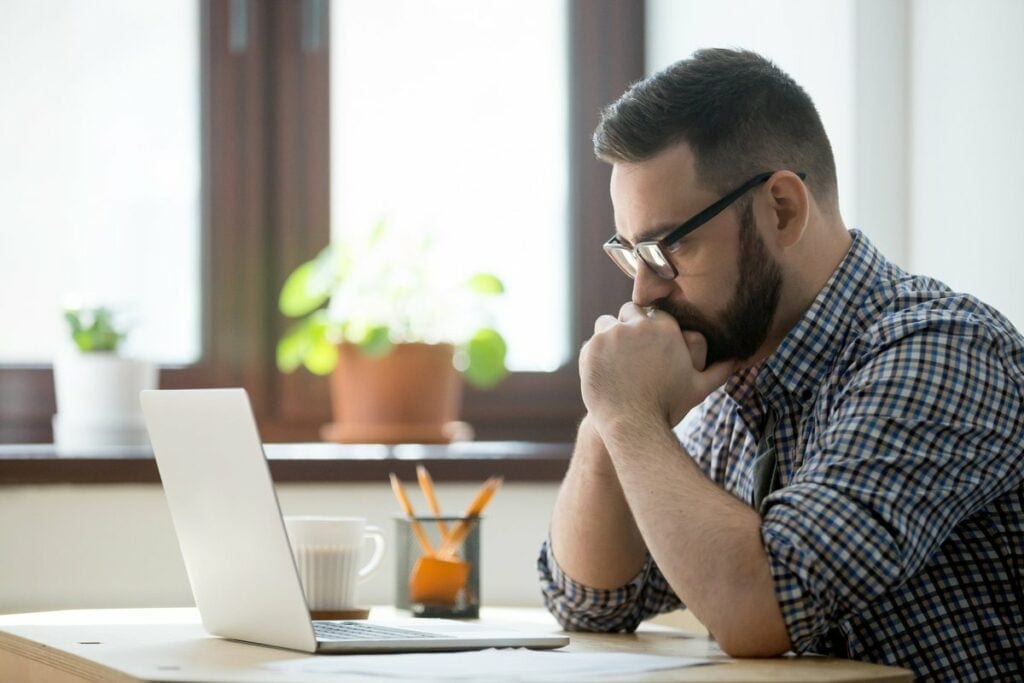 Stressed man with laptop pboAzQu.width