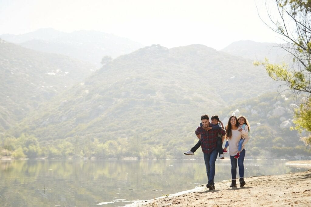 parents carrying young kids on hike hBSNf.width .jpg