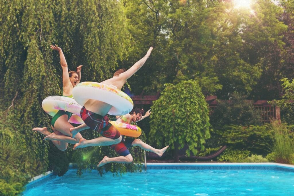 people jumping in pool RyUDQ.width .jpg