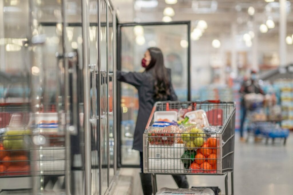 person grocery shopping at bulk store tpLXTi.width