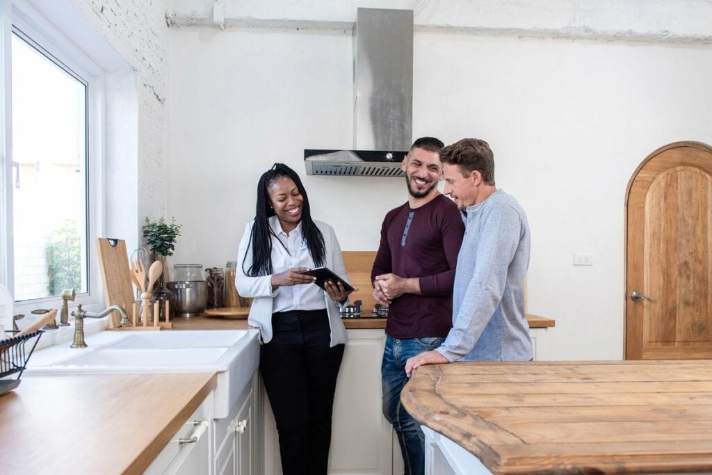 realtor showing couple new home.width
