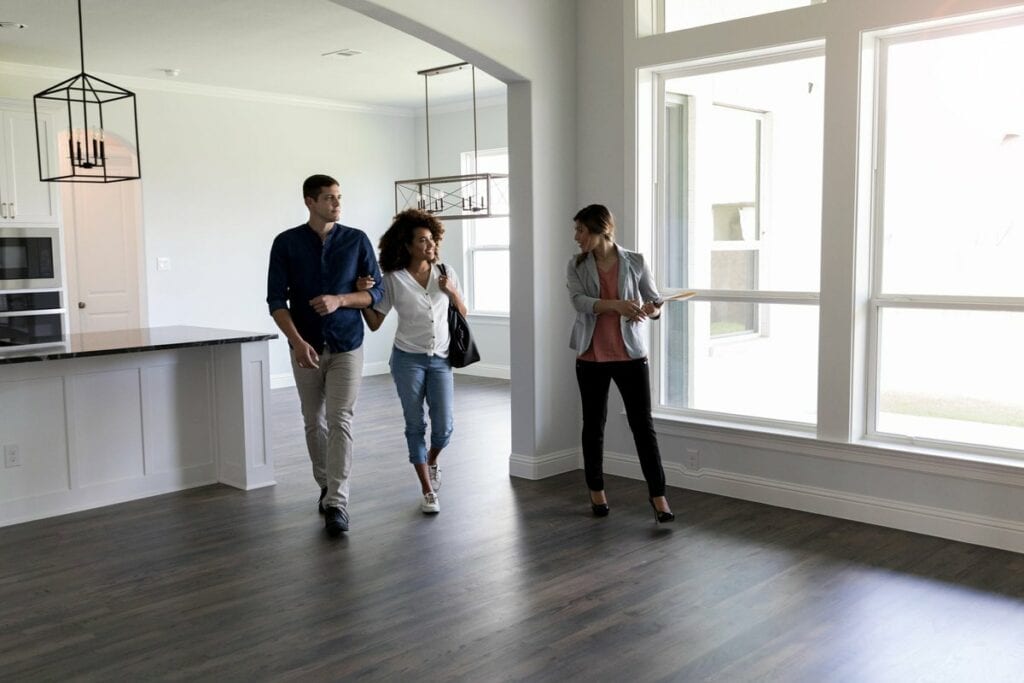 two people viewing house with realtor uSgcB.width .jpg