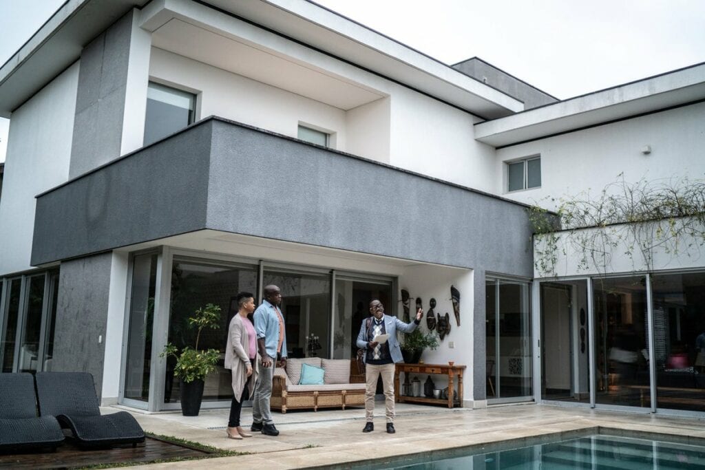 two people with realtor looking at pool rml.width