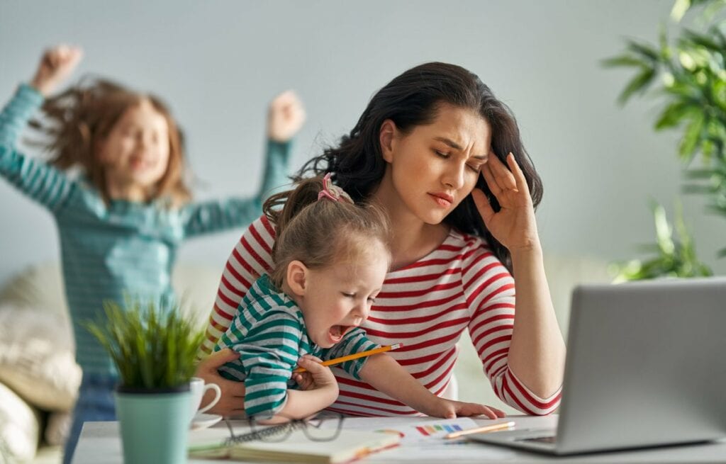 Stressed mom with kids aPoOU.width .jpg