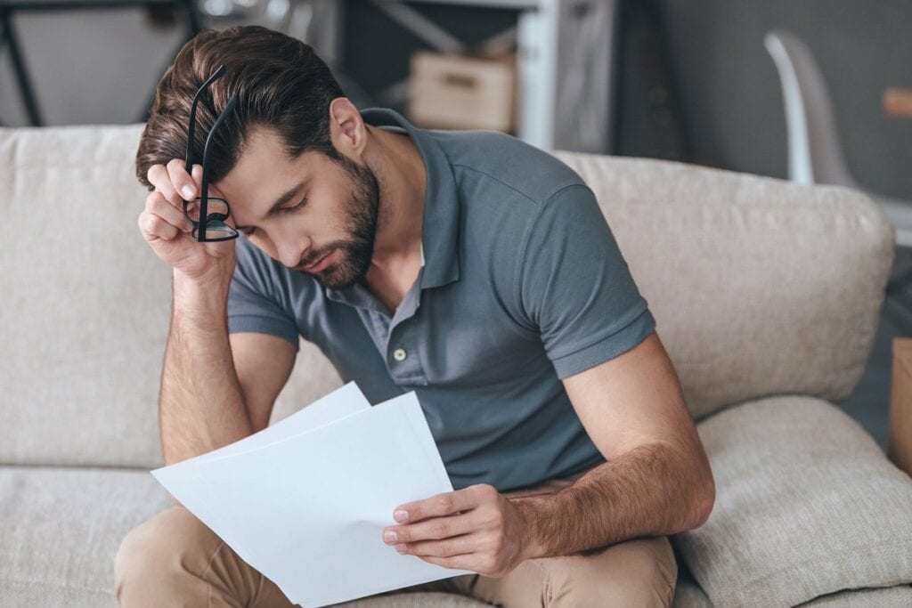 Upset man with bills wEKVP.width .jpg