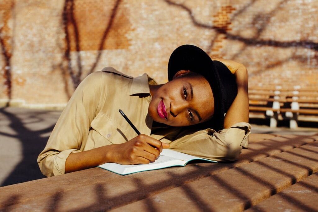Woman in park writing in journal QsKsNb.width .jpg