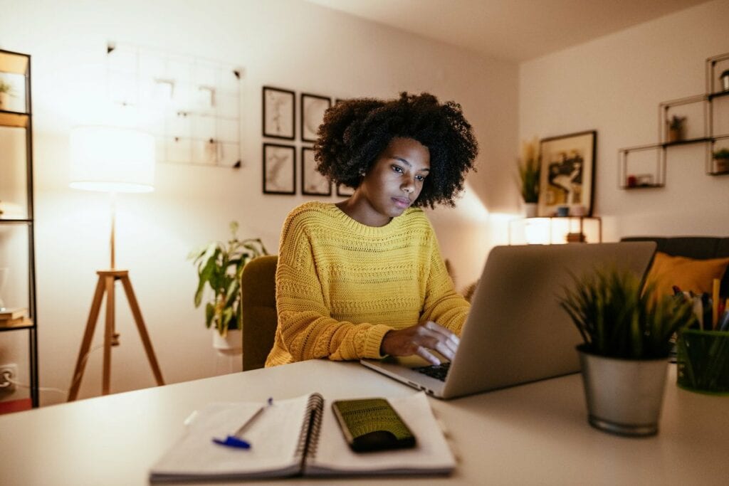 Woman using laptop at home for work or study .width .jpg