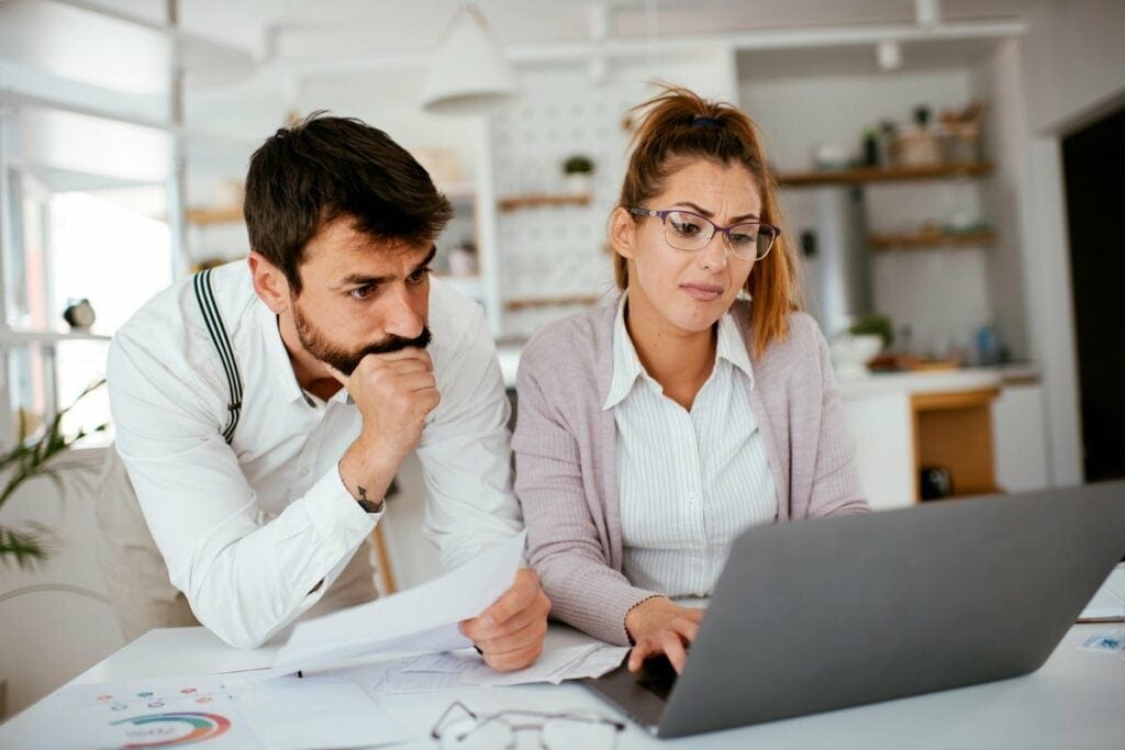 Young couple skeptically looks at information.width DDgOhN.jpg