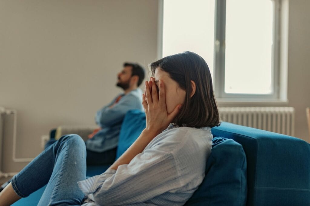 couple having an argument on couch.width .jpg