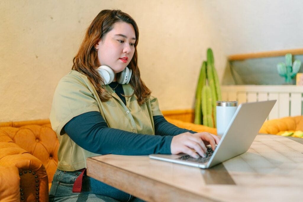 female college student at home on laptop.width .jpg