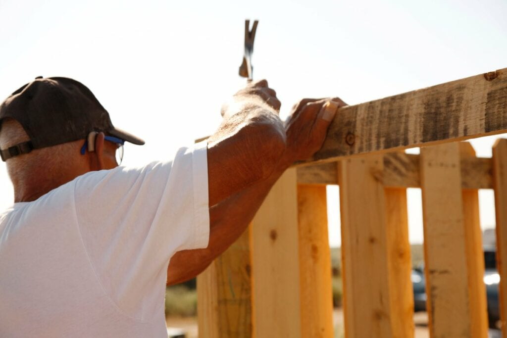 person building fence PbzLOJ.width .jpg