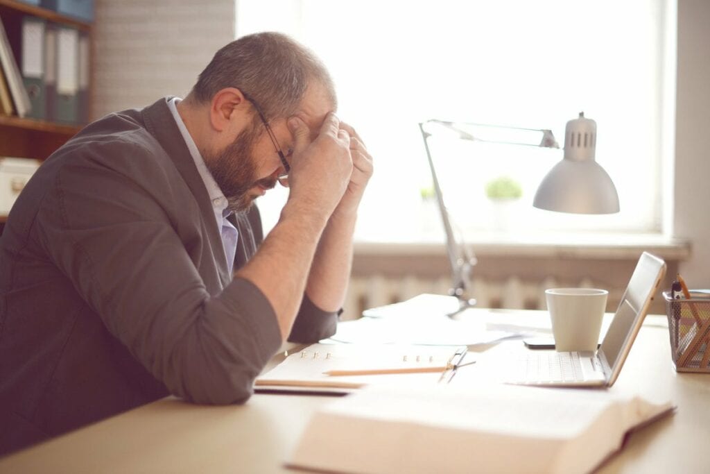 stressed man working at desk AnncGI.width .jpg