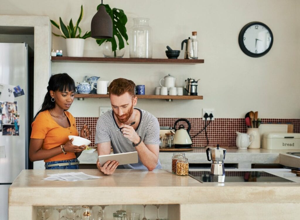 young couple in kitchen on tablet duUFRV.width .jpg