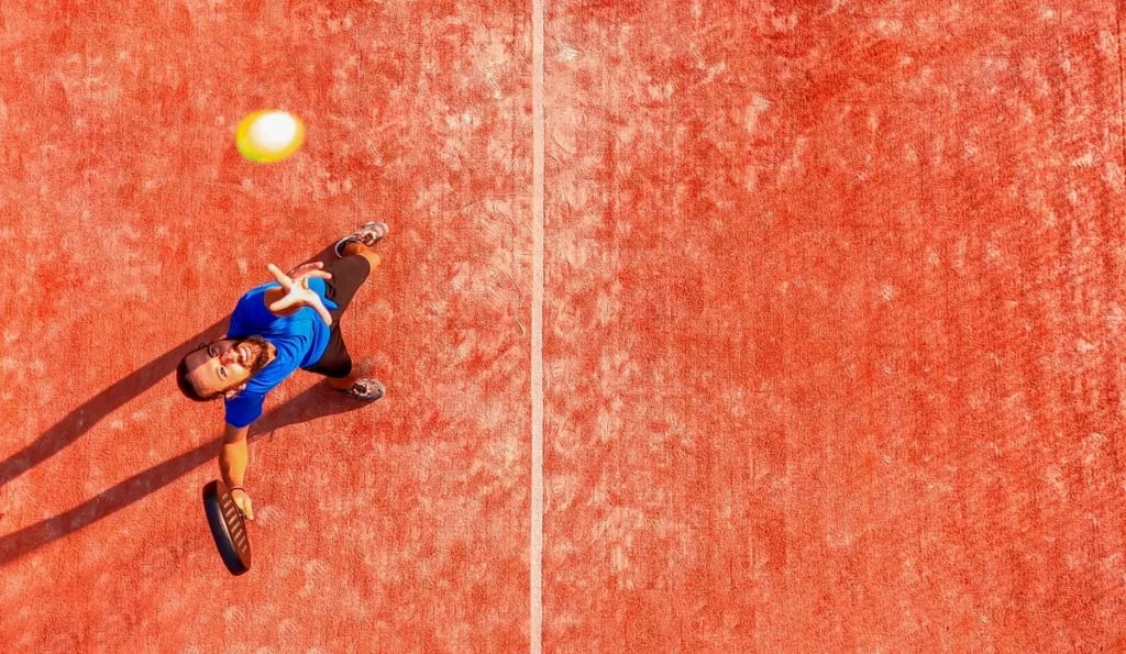 C man about to serve tennis ball ncysl.width .jpg