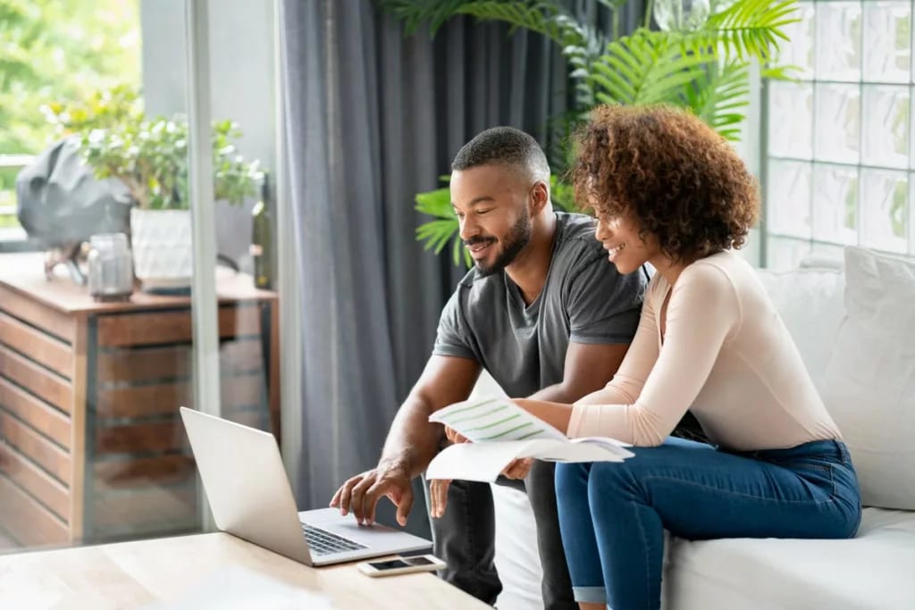 Couple sit and go over personal finances fTc.width .jpg