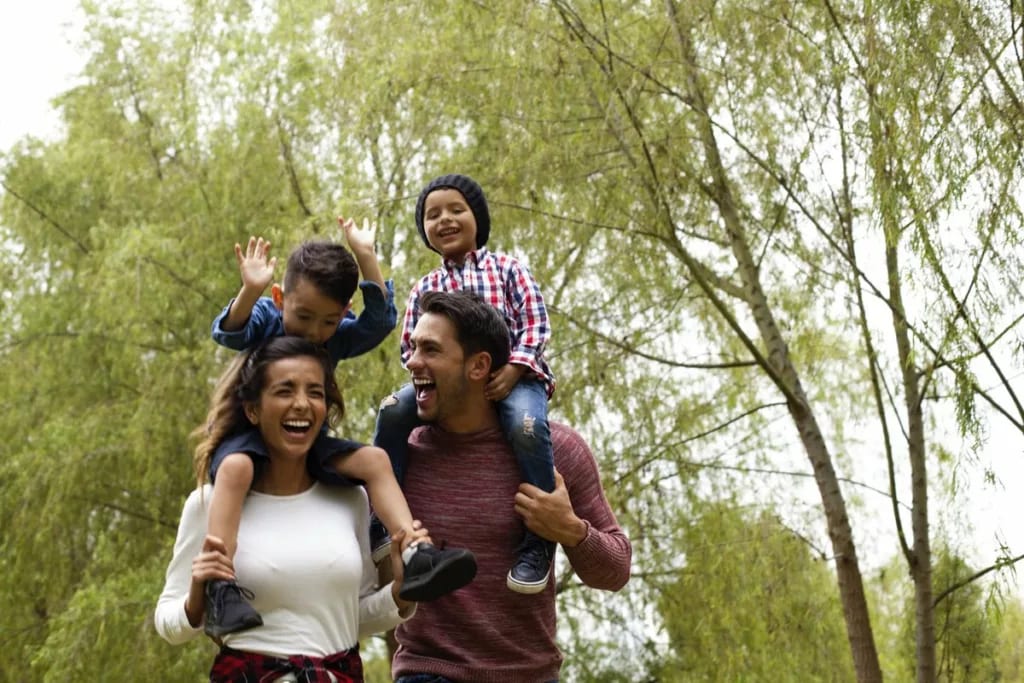 Happy family young kids outdoors.width .jpg