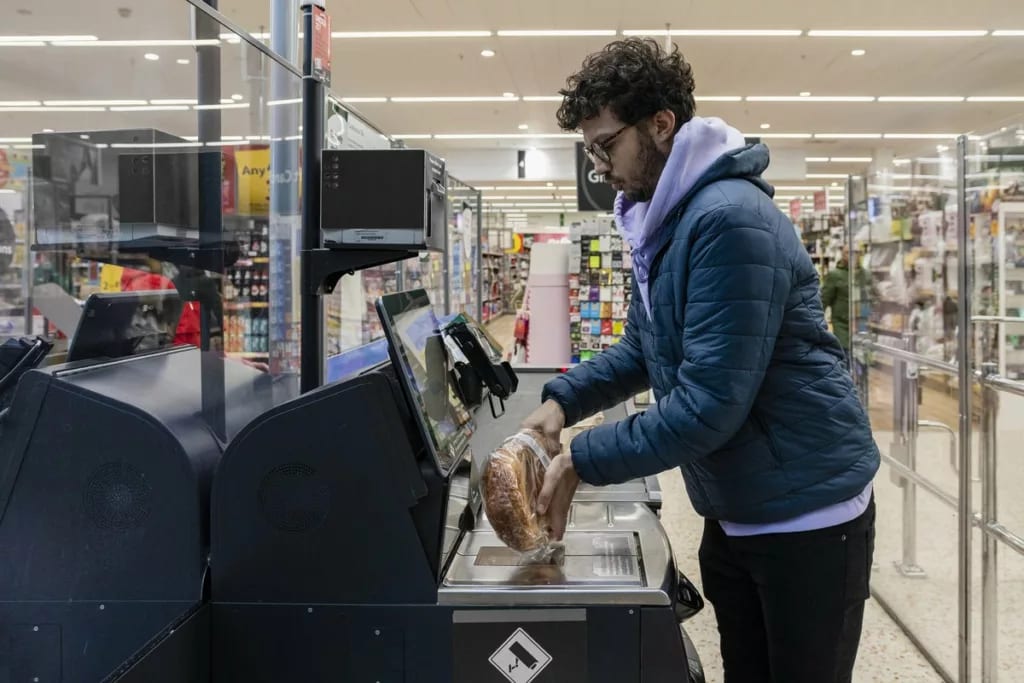Shopper using self checkout BbREs.width .jpg