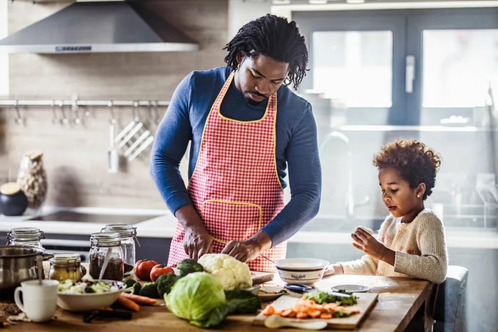 father and daughter cooking.width .jpg