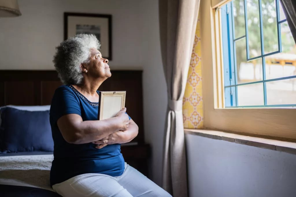 mourning loved one holding picture frame.jpg