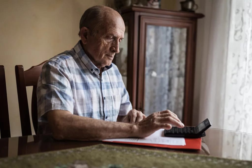 older man calculator gettyimages .jpg