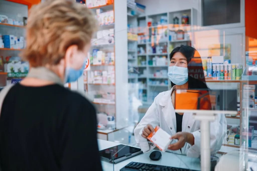 person receiving medicine from pharmacist IaP.width .jpg