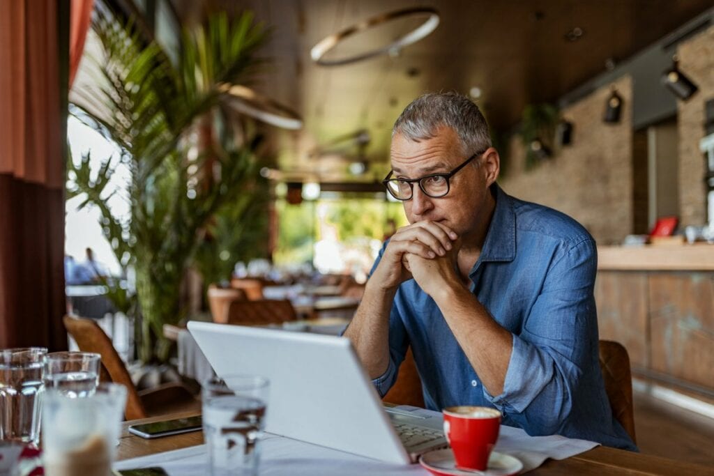 stressed man in cafe QYWidk.width .jpg