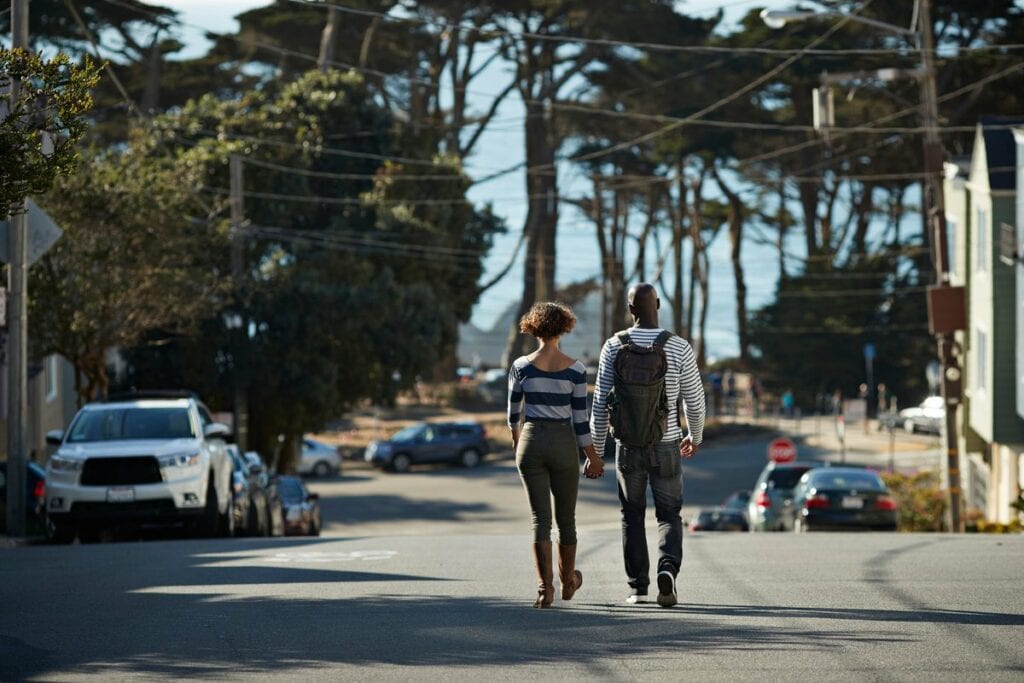two people walking down street WdvM.width .jpg