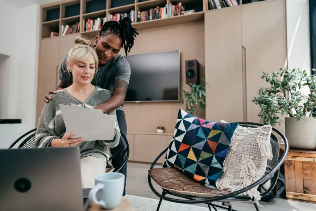 Couple having discussion while using laptop a.width oNPyjVl.jpg
