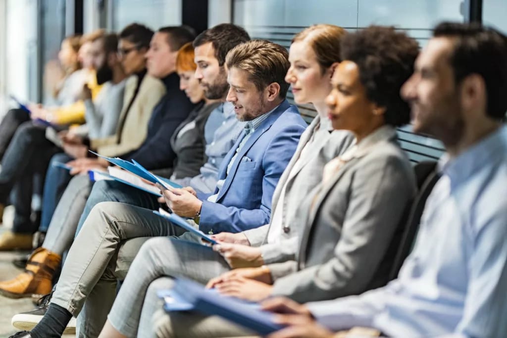 Row of people awaiting interviews VxyuZSa.width .jpg