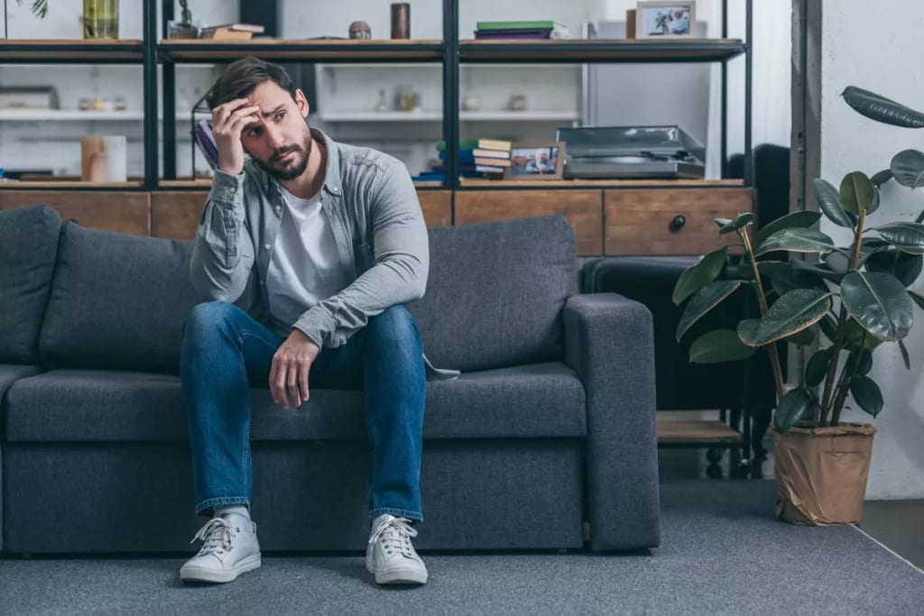 Upset man on couch gSMaXR.width .jpg
