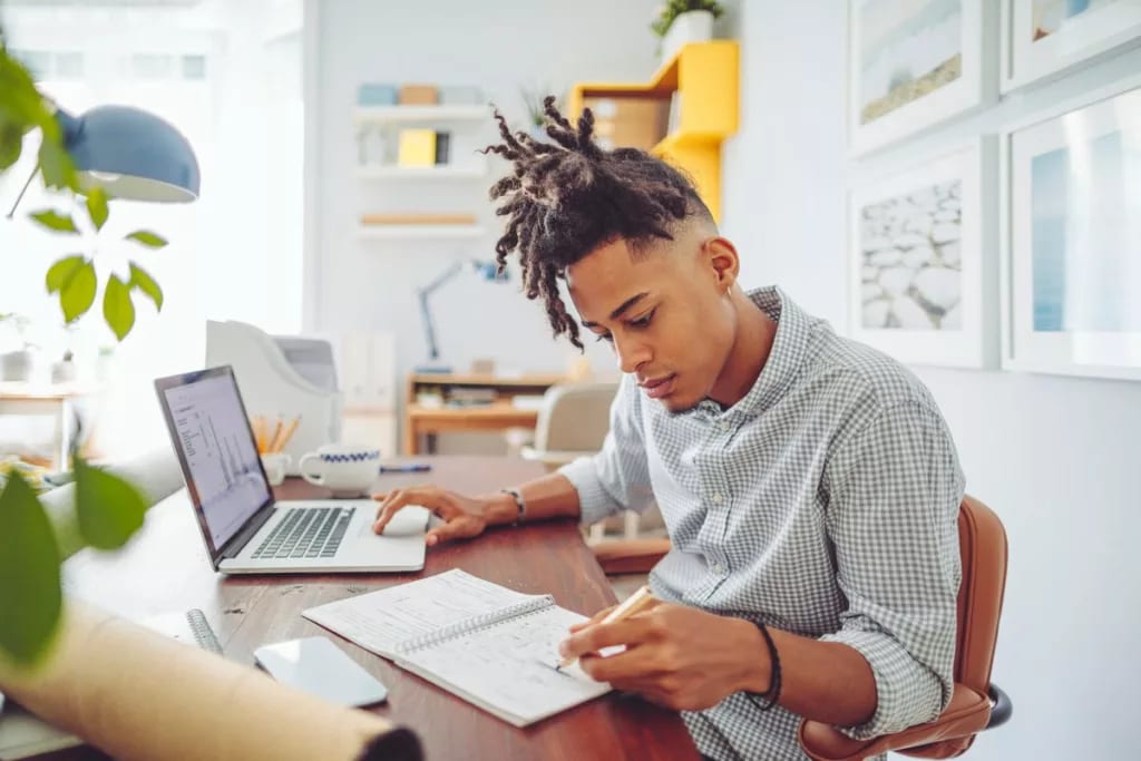 Young man looks over his investment accounts .width .jpg