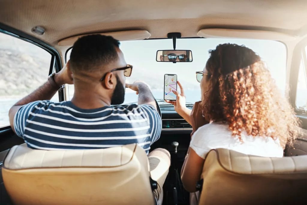 two people driving car HlRq.width .jpg